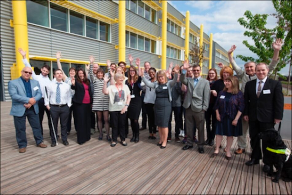 Group of people waving their hands