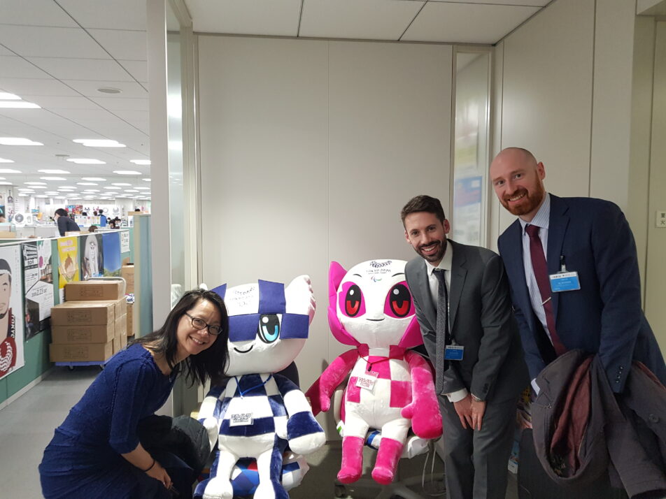 Iain and representatives from British Council and British Embassy posing with the Tokyo 2020 mascots