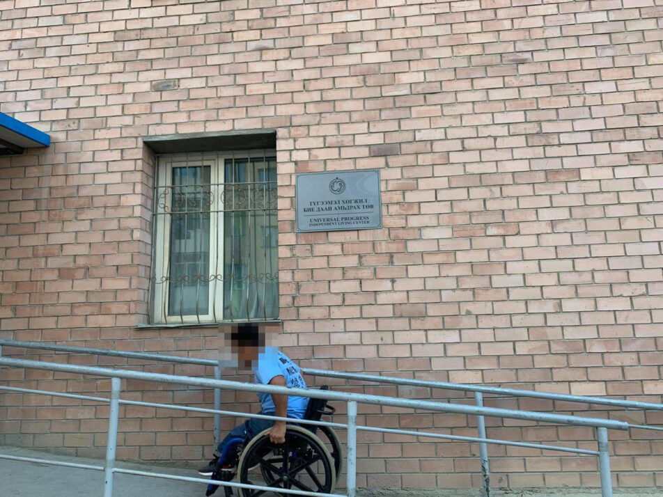 Wheelchair user in a entrance ramp