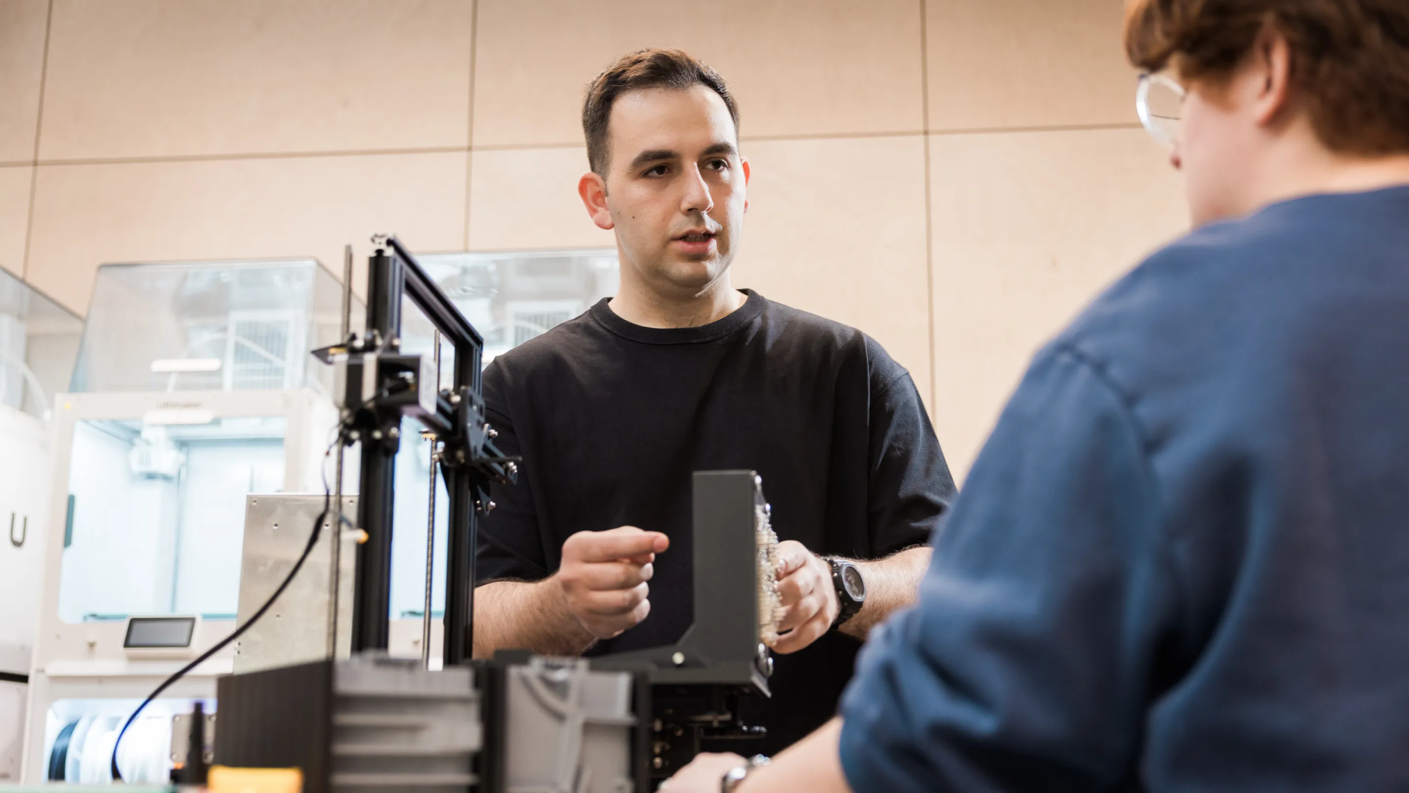 PhD students chatting in our design lab
