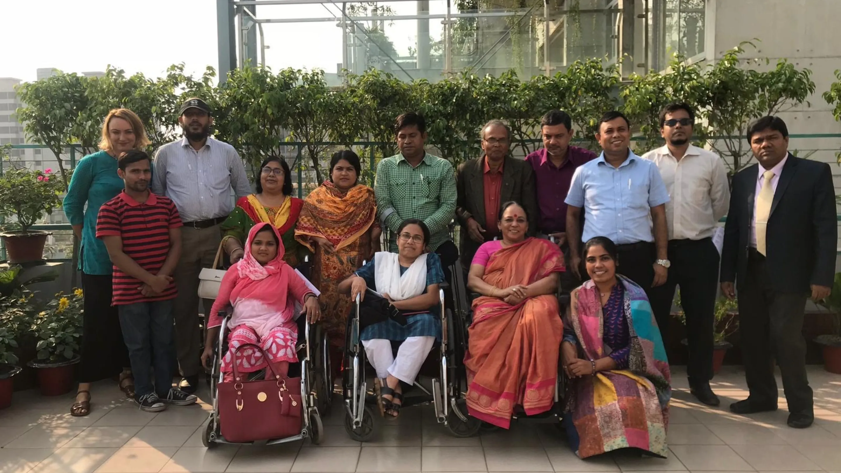 Group of wheelchair users and I2I project staff