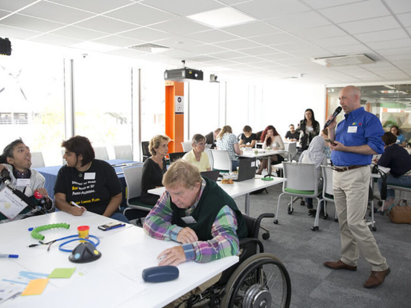 adam, 14:17 Man speaking to the mix of disabled and non-disabled people at the Loughborough University building.