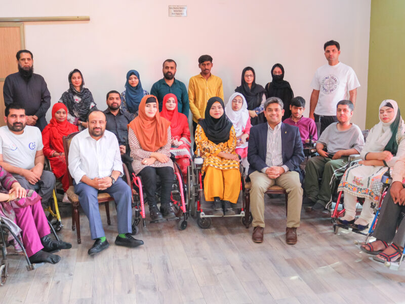 OPD workshop in Pakistan - with community group image during workshop smiling to camera
