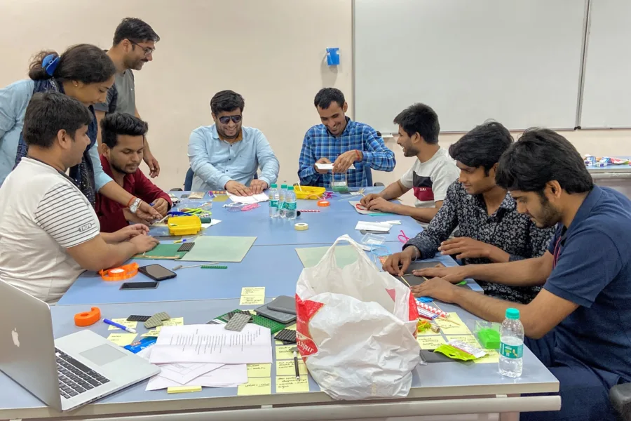 10 people around a table as part of a codesign workshop