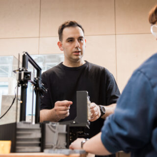 PhD students chatting in our design lab
