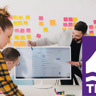 People working as a group on a desk. Tidal logo in right bottom corner