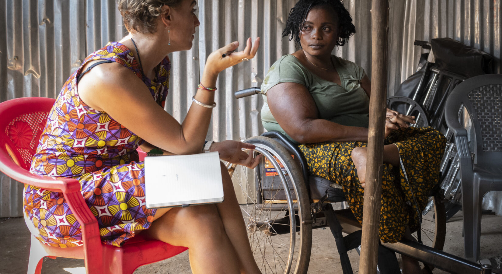 Vicki interviewing a female wheelchair user in Sierra Leone. .