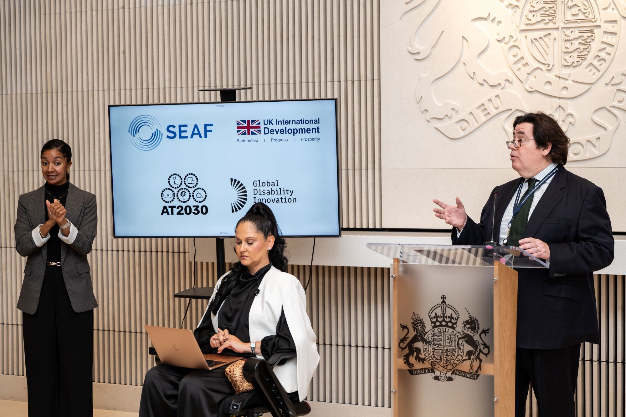 panel and hosts addressing the reception at British Embassy